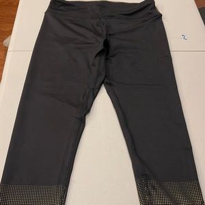 Women’s size Medium, Venus leggings. Black and gold